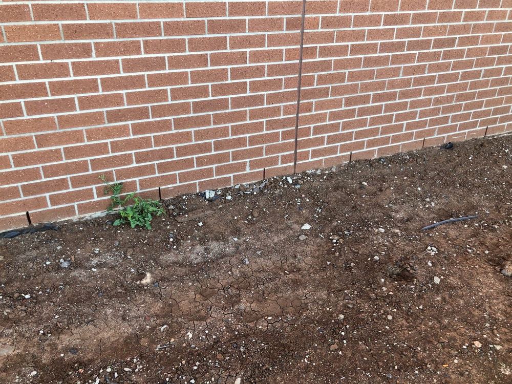 Weep holes too close to ground level, inviting water and termites in, found during a building inspection in Tarneit