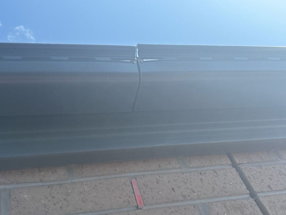 Dented metal roofing, where lost coating leads to early rusting, found during a lock-up inspection in Tarneit