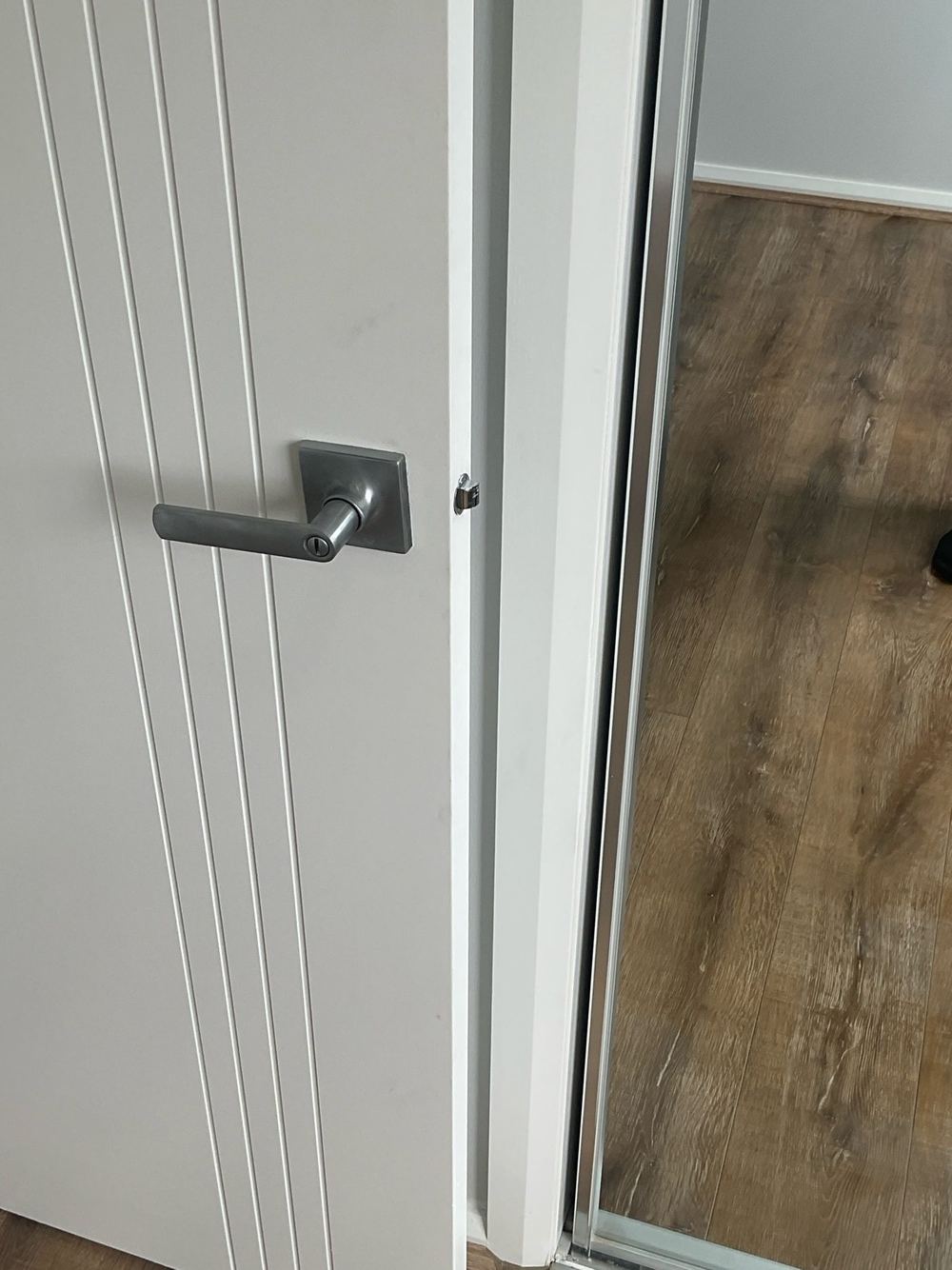 Robe door sitting proud of the jamb, the slider guide needs adjusting, found during a defect investigation inspection in Tarneit