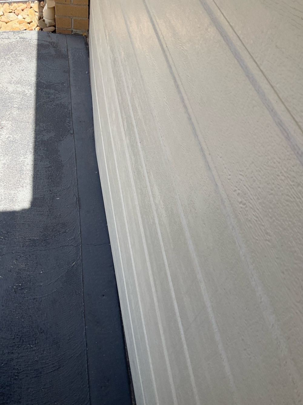 Dented and scratched garage door, found during a pre-purchase inspection in Truganina