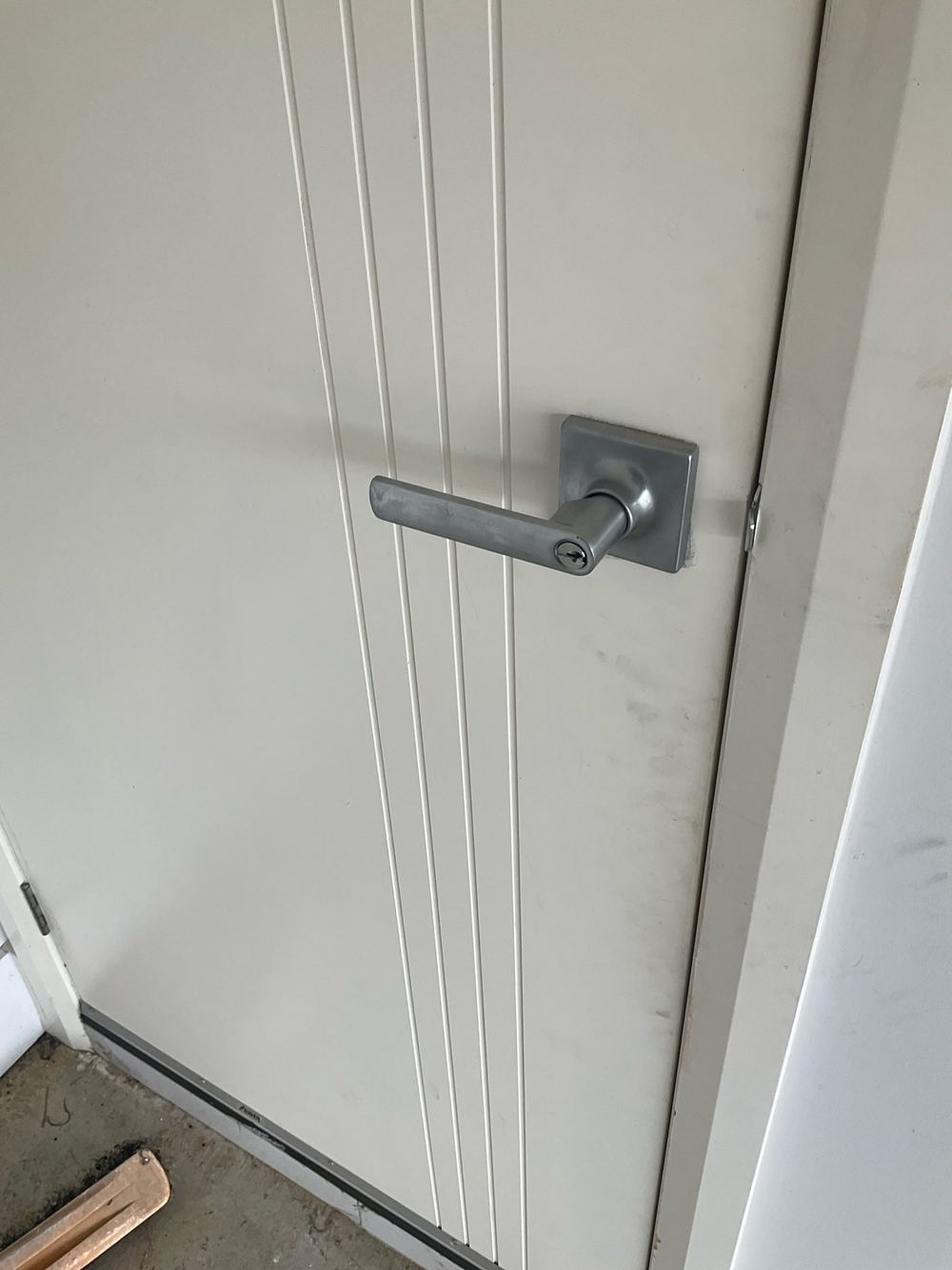 Loose garage door lock, found during a defect investigation inspection in Tarneit
