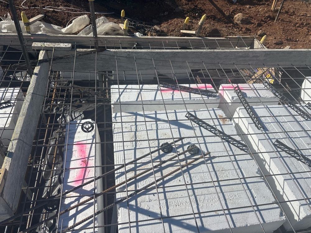 Loose waffle pods that would shift and narrow the beams during the pour, found during a slab pre-pour inspection in Tarneit
