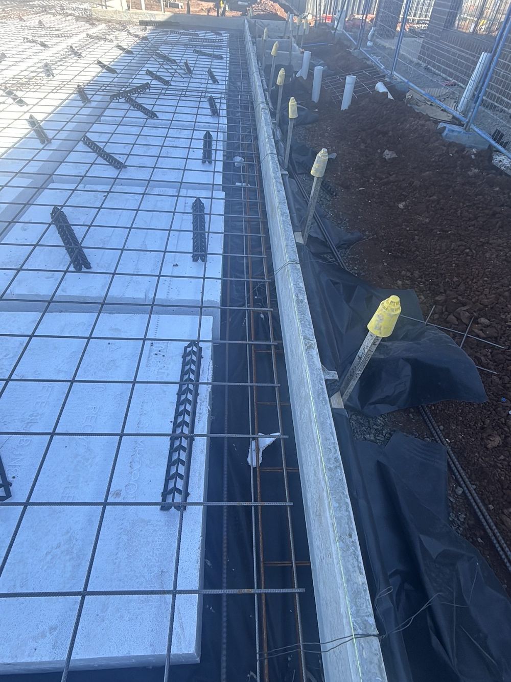 Reinforcement left with mud and rust that must be cleaned off before pouring, Tarneit
