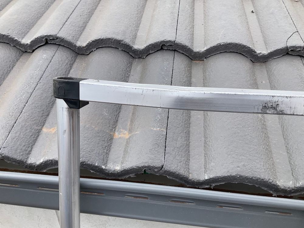 Sarking not lapped into the gutter, the likely source of a bedroom leak, found during a fixing inspection in Tarneit