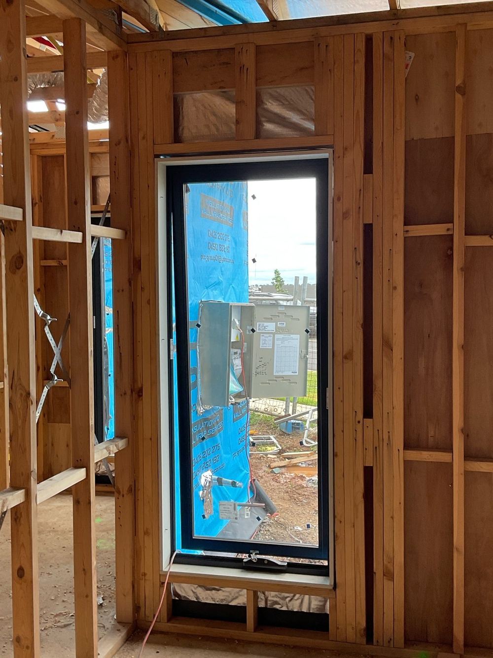 Lintel tie-down checked against the engineer's bracing and tie-down plan, found during a construction stage inspection in Tarneit