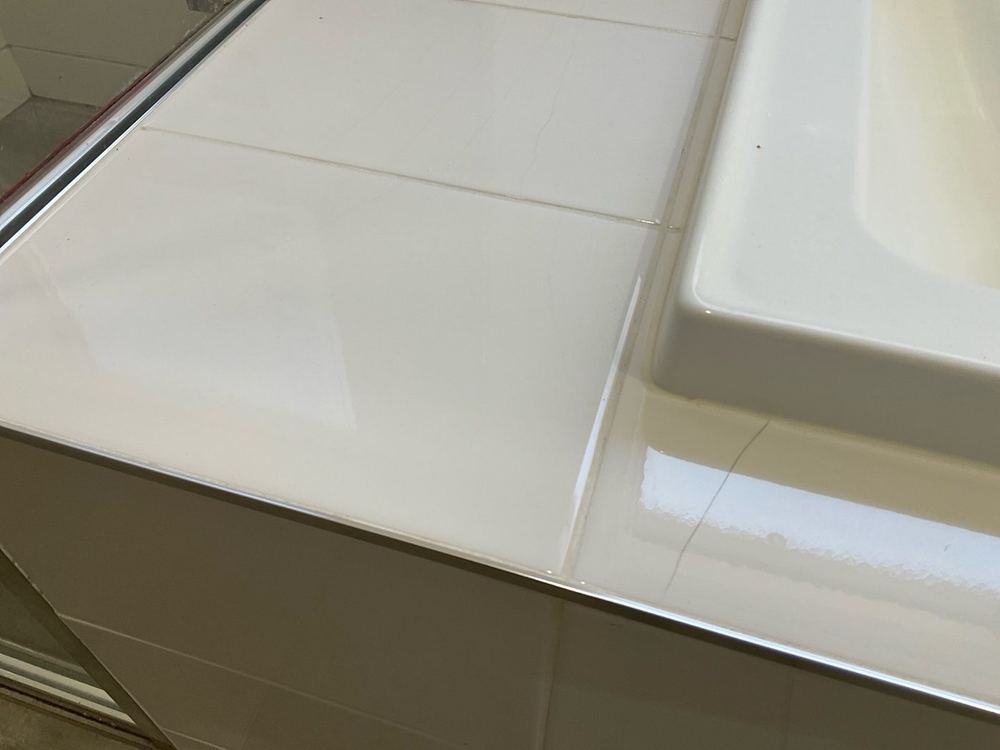 Broken and cracked tiles, found during a building and pest inspection in Point Cook